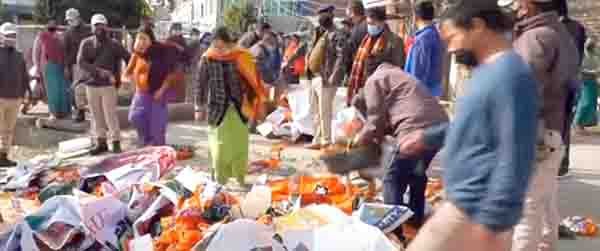 Workers and supporters of BJP ticker aspirants burning party blags and bannber over ticket denial in Imphal on Sunday (2)