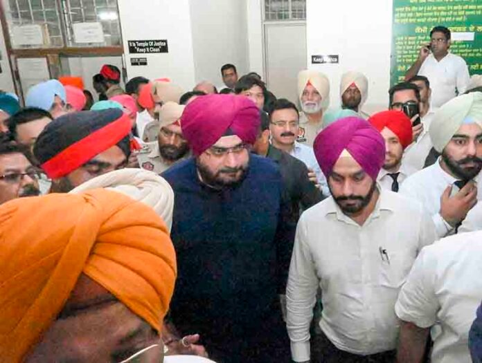 Sidhu surrenders in court